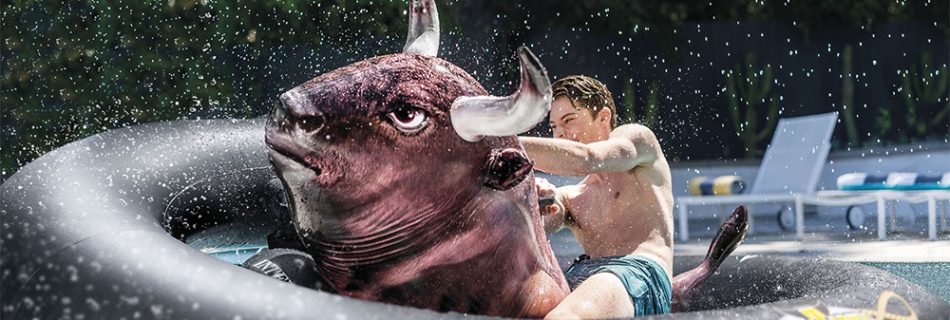 a young man riding the Inflatabull