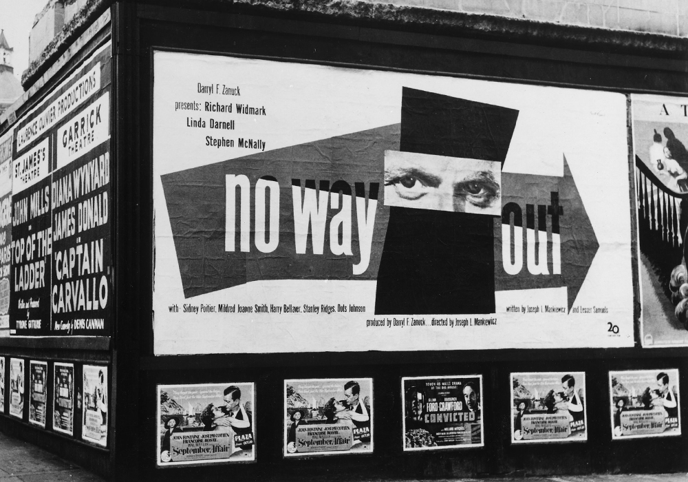 Paul Rand in front of his "No Way Out" billboard
